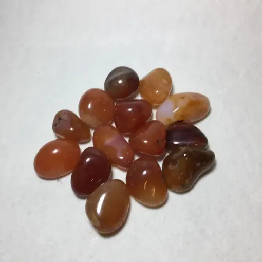 Imagen de Piedras semi preciosas Agata Cornalina Naranja rolada piedras de 2 a 2.5cms. en paquete de 100grs.