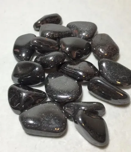 Imagen de Piedras semi preciosas Hematite rolado piedras de 2a 2.5cms. en paquete de 100grs.