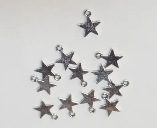 Imagen de Dije de metal forma estrella lisa de 13mms por 12 unidades color Niquel