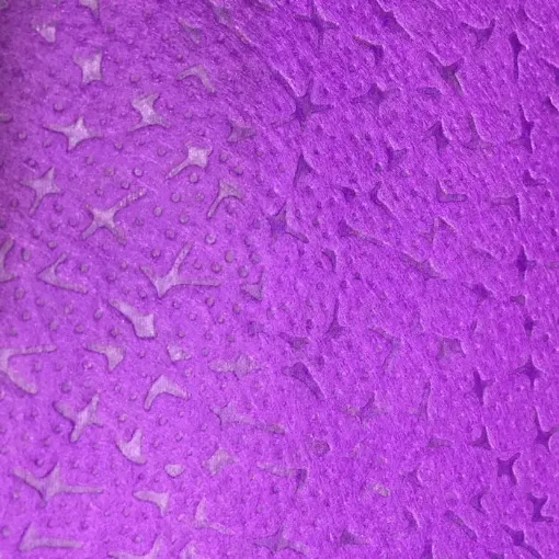 Imagen de Tnt estampado para manualidades de 70x100cms modelo piedras en fondo violeta
