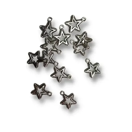 Imagen de Dije de metal forma estrella ptos calada de 15mms por 12 unidades color Niquel