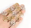 dije colgante metalico modelo corazon doble strass medida 18x16mms x5 unidades color dorado 1