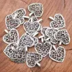 dije colgante metalico modelo corazon calado medida 26x14mms x10 unidades color plateado 0
