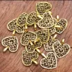 dije colgante metalico modelo corazon calado medida 26x14mms x10 unidades color dorado 0