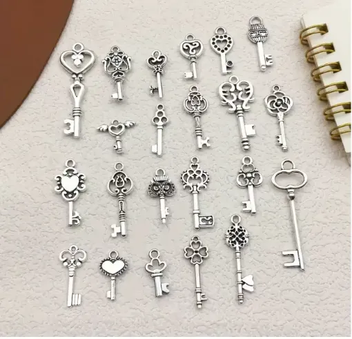 dije colgante metalico modelo llaves medida 10 30mms x10 unidades surtidas color plata antigua 0