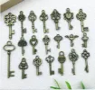 dije colgante metalico modelo llaves medida 10 30mms x10 unidades surtidas color bronce antiguo 0