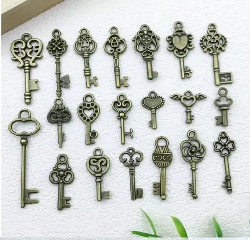 dije colgante metalico modelo llaves medida 10 30mms x10 unidades surtidas color bronce antiguo 0